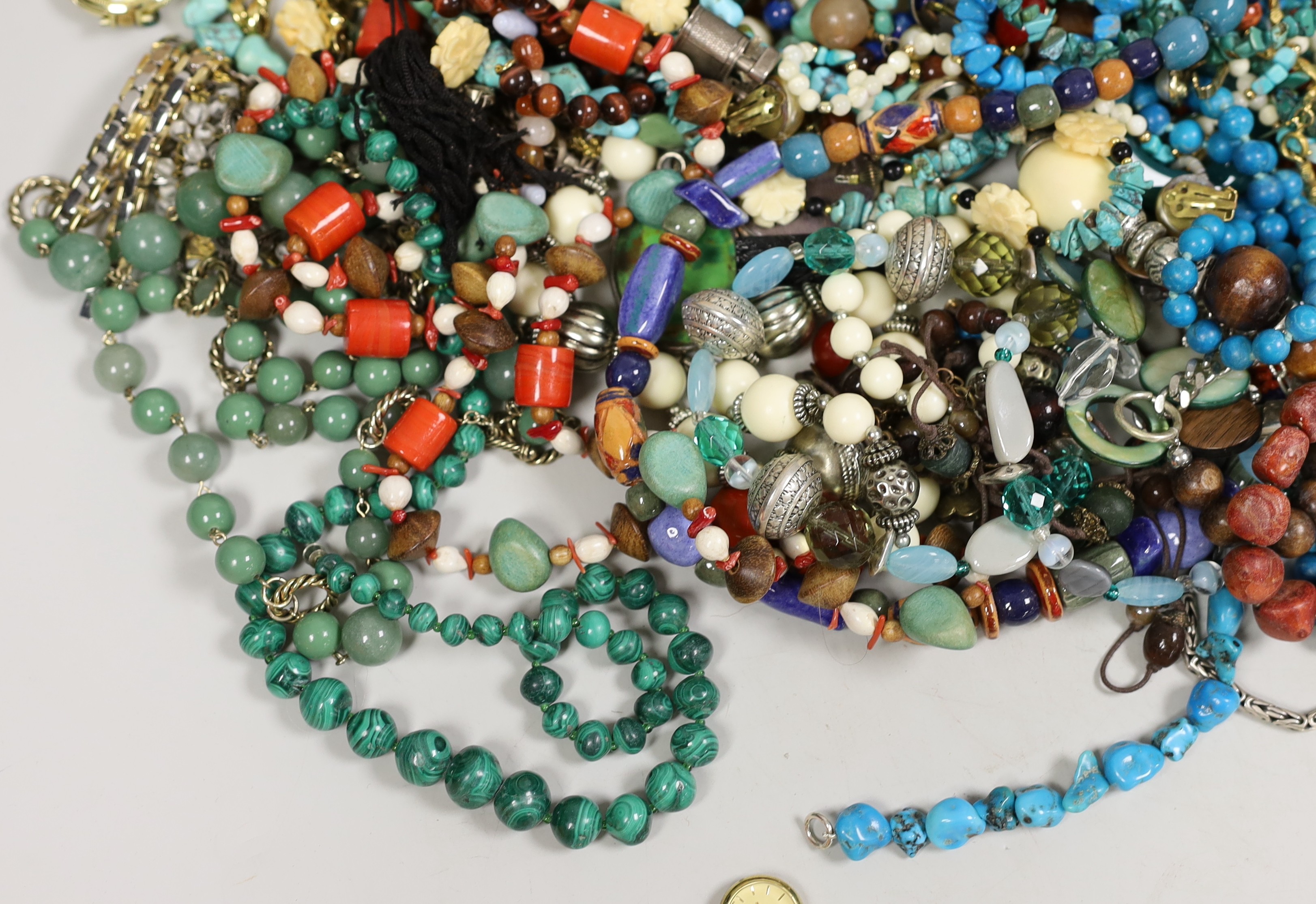 A quantity of assorted costume jewellery, including white metal and moonstone bracelet and other items including a small silver plated Dunhill lighter.